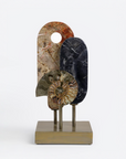 Decorative sculpture with stone-like textures on a white background