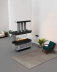 Modern living room with a glass-enclosed fireplace, sofa, and chair.