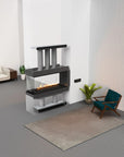 Modern living room with a glass-enclosed fireplace, sofa, and chair.