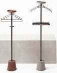 Two clothing stands with hangers and trays on a white background