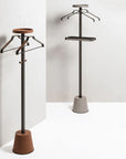Two clothing stands with hangers on a white background