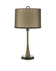Table lamp with a bronze shade and clear base on a white background from Pieter Adam available at Spacio in India.