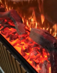 A Planika Fireplace Electric LED Astro Wall Mounted, featuring 3D LED technology, showcasing realistic logs and flames.