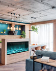 A kitchen with a blue walls and a Planika Fireplace Electric LED Astro Wall Mounted that showcases design flexibility with 3D LED technology.