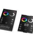 A Planika Fireplace Electric LED Astro Wall Mounted remote control for a lighting system with Design Flexibility.