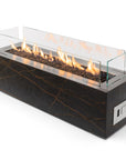 Modern rectangular gas fire pit with glass front on a white background