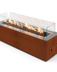 Rectangular gas fireplace in Corten steel  with flames on a white background from Planika available at Spacio in India.
