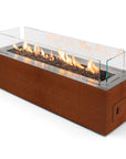 Rectangular gas fireplace in Corten steel with flames on a white background from Planika available at Spacio in India.