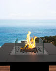 Outdoor fire pit table from Planika with ocean view available at Spacio retail stores in Mumbai & Kolkata.