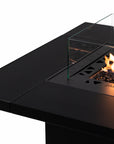 Close up of a gas fire pit table with flames on a white background from Planika available at Spacio retail stores in Mumbai & Kolkata.