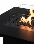 Close up of a gas fire pit table with flames on a white background from Planika available at Spacio retail stores in Mumbai & Kolkata.