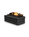 A free standing fireplace with artificial logs from Planika on a white background available at Spacio retail stores in Mumbai & Kolkata.