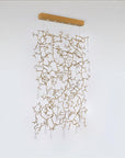 Decorative hanging curtain screen light fixture with intricate design on a white background