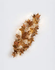 Decorative sculptural wall light on a white background