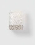 Decorative wall light with wavy texture on a white background