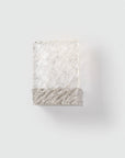Decorative wall light with wavy texture on a white background