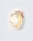 Decorative wall light fixture with a natural marble on a white background
