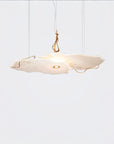 Modern pendant light with a cloud-like design on a white background