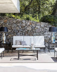 Sifas Cross collection of three Sofa seating with a chair, center table & decorative table lamps at exterior available at Spacio India for luxury home Outdoor Furniture decor collection