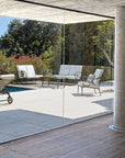 Distant view of Sifas Cross collection of two Sofa seating with a chair & center table at exterior available at Spacio India for luxury home Outdoor Furniture decor collection