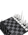 Skyline Chess set showcasing Tokyo and Dubai architecture with high-quality acrylic chess pieces on a luxury hatch-patterned wood/marble board, available at Spacio India.