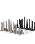 Skyline Chess Steel Dubai Marble Board – A luxury chess set featuring iconic Dubai skyscrapers like Burj Khalifa and Cayan Tower, crafted in stainless steel and bronze, available at Spacio India.