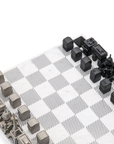 Skyline Chess Steel Paris Marble Board featuring luxury stainless steel chess pieces inspired by Paris architecture, available at Spacio India.