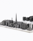 Close up of Skyline Chess Steel Paris Marble Board featuring luxury stainless steel chess pieces inspired by Paris architecture, available at Spacio India.
