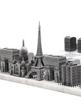 Close up of Skyline Chess Steel Paris Marble Board featuring luxury stainless steel chess pieces inspired by Paris architecture, available at Spacio India.