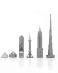 Close-up of stainless steel chess pieces showcasing world-famous buildings like the Empire State Building and Oriental Pearl Tower from the Skyline Chess set.