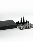 A high-end luxury board game, the Skyline Chess Steel 2 City London New York Hatch Board, crafted in wood and stainless steel. Now at Spacio India. Available with a gift box.