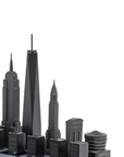 New York skyline chess pieces in Skyline Chess Steel 2 City London New York Hatch Board, featuring Empire State Building, Chrysler Building, and One World Trade Center, available at Spacio India.