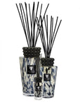 Three Baobab Black Pearls 250ml Diffuser Mini TOTEMXSPB with black and white designs, infused with the fragrance of black pearls and ginger.