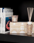 Baobab Paris My First Baobab TOTEMMSSI fragrance diffuser and book on a shelf.