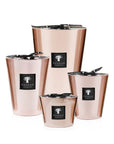 A set of four Baobab Roseum Candle MAX16ROS adorned with black ribbons, perfect for adding a touch of femininity to any space.