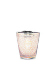 A Baobab Women Candle MAX16WOM in a glass with a pattern on it, supporting the Breast Cancer Foundation.