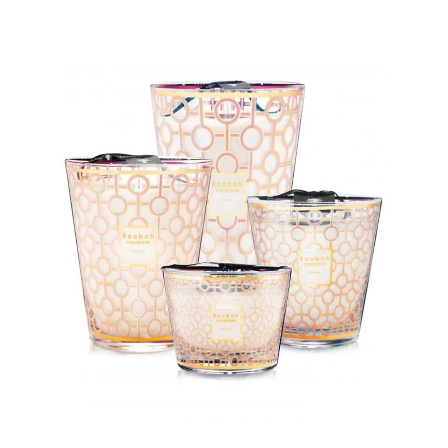 A set of three Baobab Women Candle Max 10 MAX10WOM glass candle holders with a breast cancer research pattern on them.
