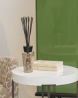 Baobab Women Diffuser 500ml DIF500WOM by Baobab on a table next to a green cabinet.