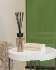 Baobab Women Diffuser 500ml DIF500WOM by Baobab on a table next to a green cabinet.