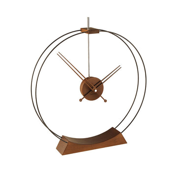 A Nomon Aire AIR circular ring wooden clock on a wooden stand.