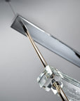 The Italamp Piola lighting fixture, produced by Italamp, features a stunning glass rod suspension.