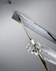 The Italamp Piola lighting fixture, produced by Italamp, features a stunning glass rod suspension.