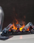 Close up of artificial water vapour fireplace with glowing logs and flames on a dark background available at Spacio retail stores in Mumbai & Kolkata.
