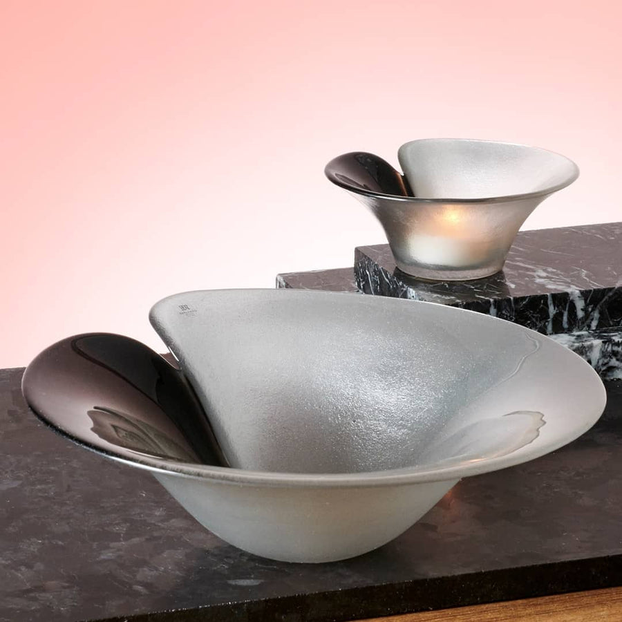 Maleras Crystal Magic Silver Bowl with other small bowl on wooden table with light orange back ground for modern interiors available at Spacio India from Decor Accessories and Tableware Collection of Decorative Bowls.