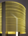 The Masiero Ebe Collection features Masiero Ebe Table Lamps adorned with precious stones, including a lamp with a yellow shade and a black base.