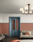 A living room with luxurious couches and a Masiero Tee Chandelier from the Masiero brand.