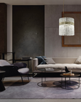 A modern living room with Masiero Vegas Chandelier lights and furniture.