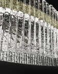 A breathtaking Masiero Vegas Floor Lamp, exuding opulence, created entirely of ice against a striking black background.