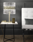 A white couch and a Masiero Vegas Table Lamp in a room with black walls.