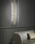 A Masiero Vegas Wall Sconce from the Masiero Collection, adding opulence to a living room through decorative lighting.
